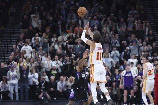 Trae Young a réussi l'un des tirs de la saison à Salt Lake City. KEYSTONE/AP/Rob Gray