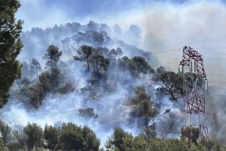 L'incendie a parcouru 750 hectares depuis la commune limitrophe des Pennes-Mirabeau. KEYSTONE/AP
