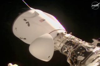 On voit la capsule de SpaceX, avec quatre personnes à bord, s'amarrer à la Station spatiale ISS, KEYSTONE/AP