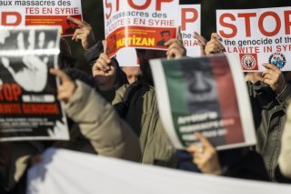 Des représentnats de plusieurs minorités syriennes ont notamment dénoncé l'attitude des forces de sécurité contre les alaouites il y a quelques mois dans l'ouest de la Syrie (archives). KEYSTONE/MARTIAL TREZZINI