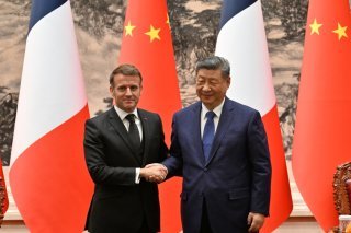 "J'ai vu une volonté du Président Xi de contribuer à la stabilité et à la paix", a assuré Emmanuel Macron. KEYSTONE/AP/Adek Berry