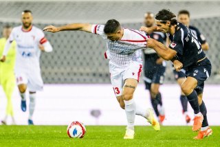Rilind Nivokazi à la lutte avec le Thounois Jan Bamert.