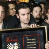 De gauche à droite, Robert Smith, Simon Gallup et Parry Bamonte en 2004. KEYSTONE/AP/Chris Pizzello