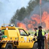 Six incendies importants sont actuellement recensés dans l'Etat de Victoria, notamment dans les Otways, un secteur au sud-ouest de Melbourne connu pour ses forêts d'eucalyptus peuplées de koalas à proximité de la très touristique Great Ocean Road. KEYSTONE/EPA/DARREN ENGLAND
