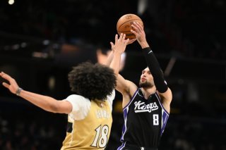 Kyshawn George (de dos) et les Wizards ont battu les Kings dimanche KEYSTONE/AP/Nick Wass