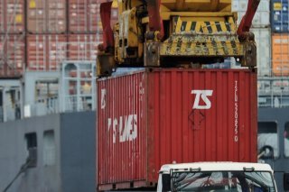 Le chiffre officiel de la croissance en Chine, éminemment politique et sujet à caution, n'en reste pas moins toujours scruté de près compte tenu du poids de la deuxième économie mondiale. (AP Photo/Andy Wong)