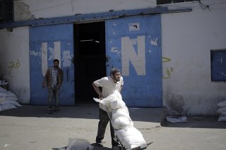 L'ONU assure une présence régulière dans la bande de Gaza, notamment en assurant le ravitaillement dans ses dépôts (Photo d'illustration). KEYSTONE/EPA/ALI ALI