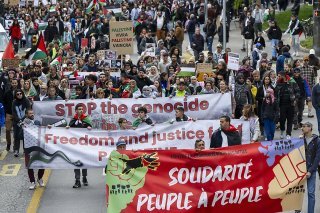 Les manifestants à Genève ont dénoncé le "silence" de la Suisse. KEYSTONE/MARTIAL TREZZINI