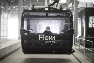 Les cabines du FlemXpress ne circulent que sur demande et doivent relier six stations d'ici à la fin de l'année 2023 (Archives). KEYSTONE/GIAN EHRENZELLER