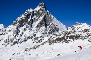 Arnaud Boisset of Switzerland in action front of the Matterhorn/Cervino mountain during the men's downhill training race on the new ski course